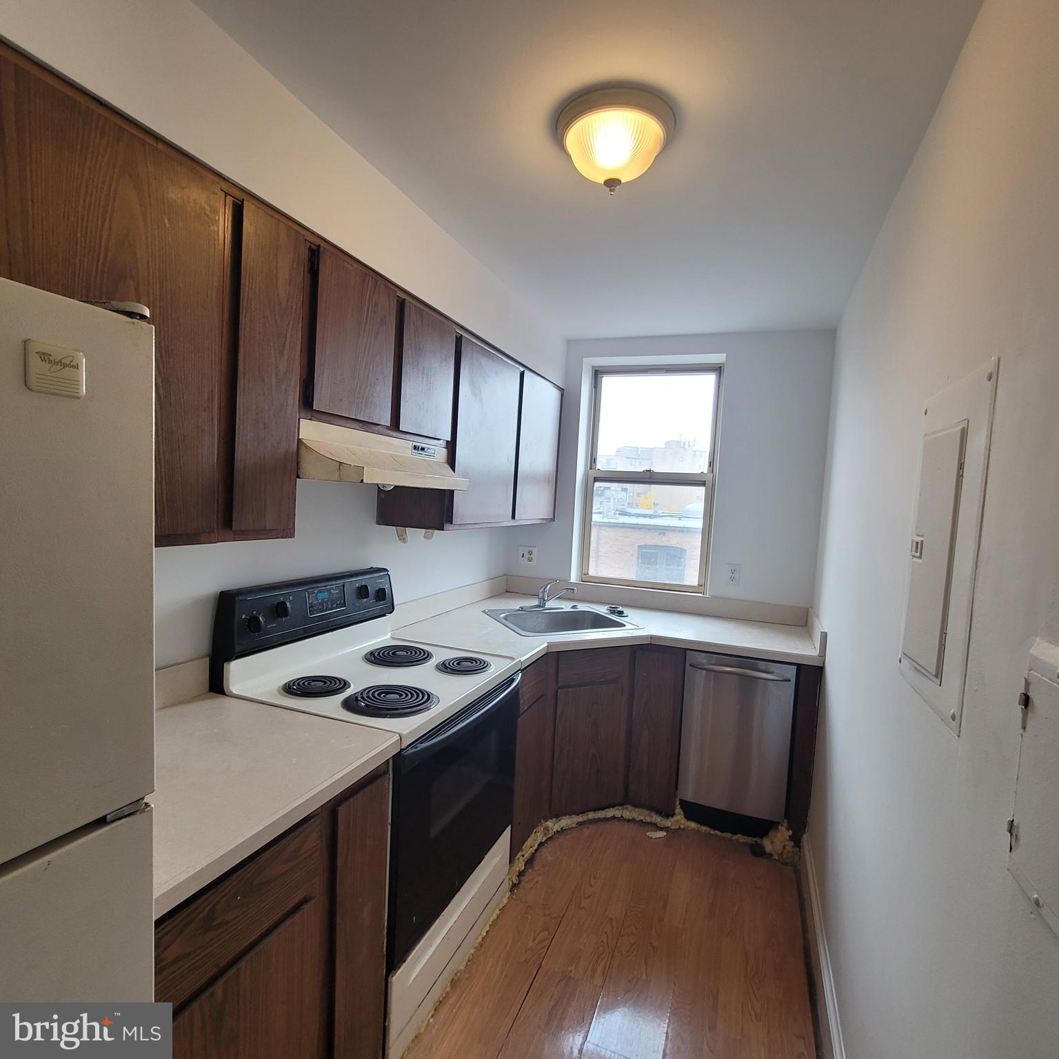 1673 Park Road Northwest, Unit 502 Washington, DC 20010 - Photo 9 of 23 a kitchen with stainless steel appliances a stove a sink and a refrigerator