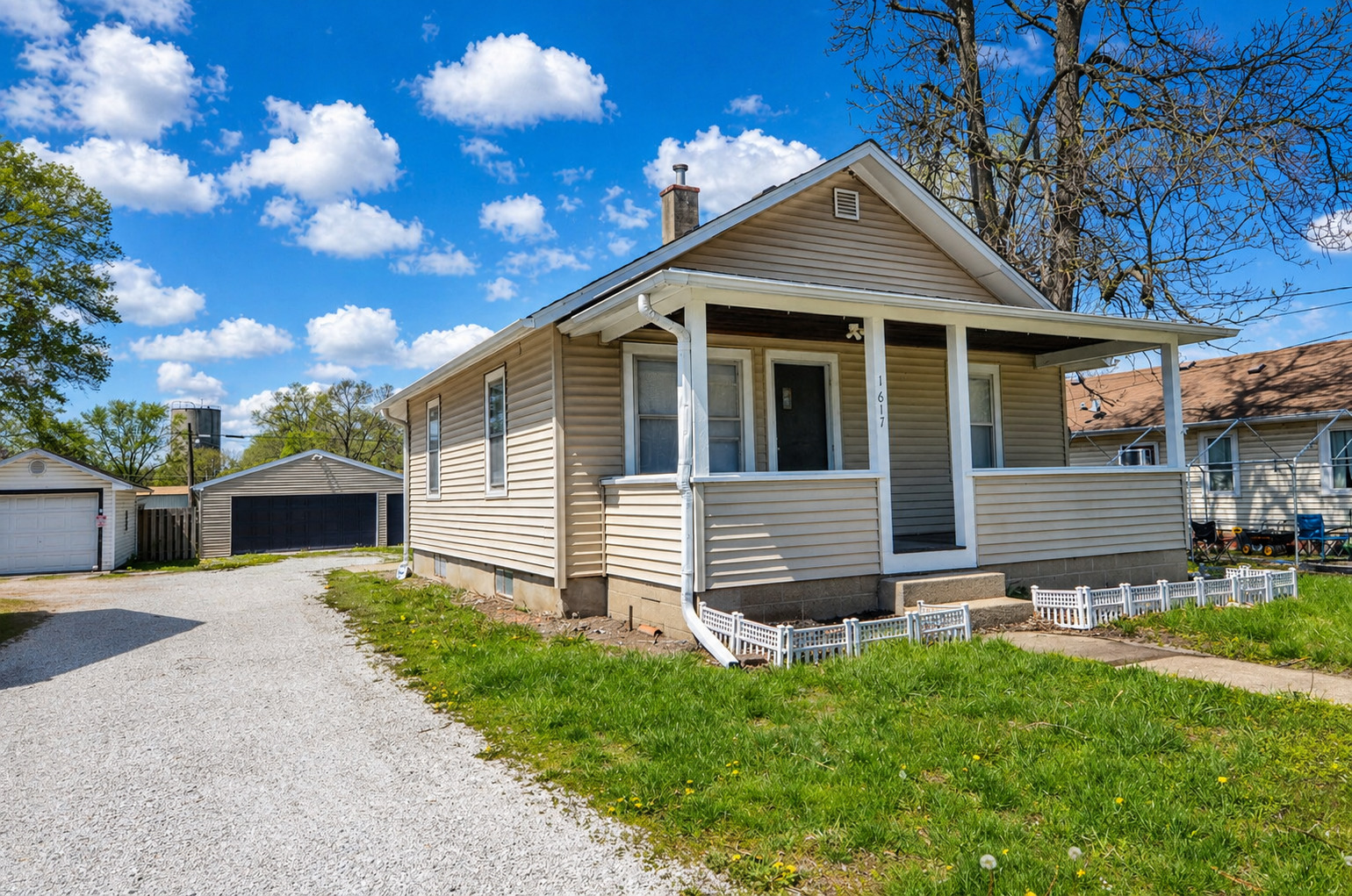 1617 Pine Street Ottawa, IL 61350 - Photo 1 of 13 a front view of a house with garden