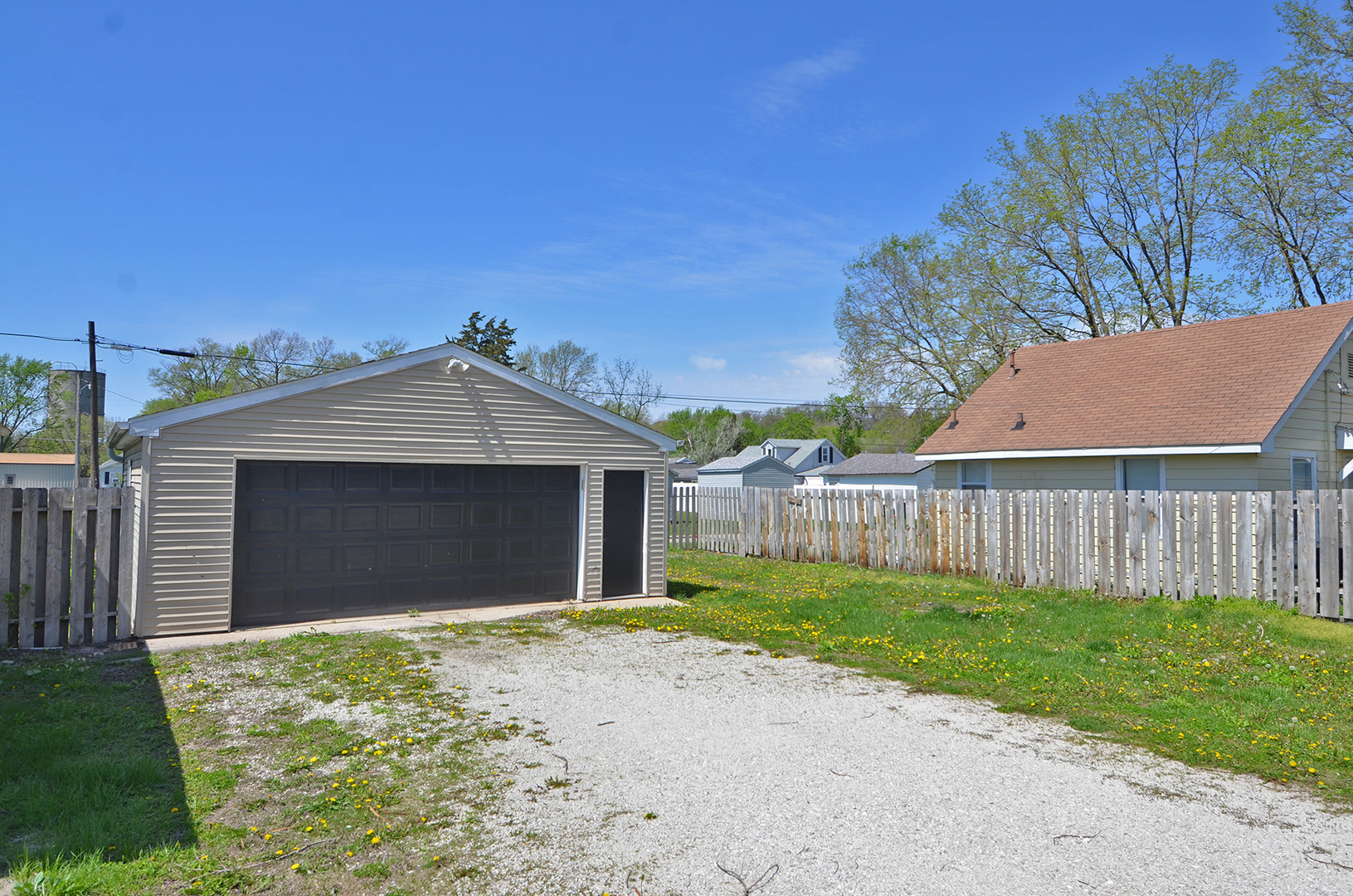 1617 Pine Street Ottawa, IL 61350 - Photo 11 of 13 a front view of a house with a yard and garage