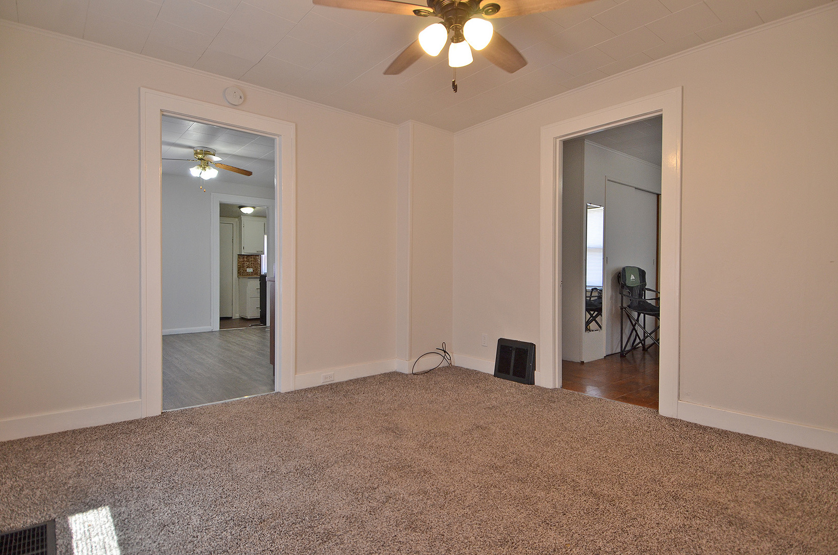 1617 Pine Street Ottawa, IL 61350 - Photo 2 of 13 a view of a room with a ceiling fan and bathroom