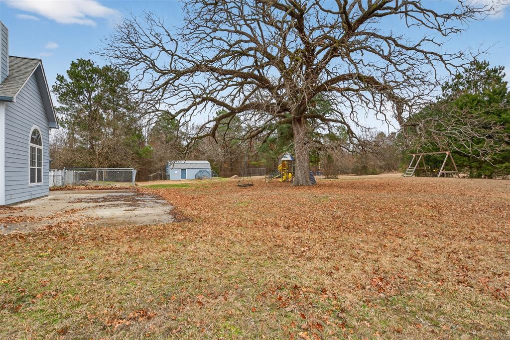 720 Haggerty Road Karnack, TX 75661 - Photo 28 of 39 a house view with yard