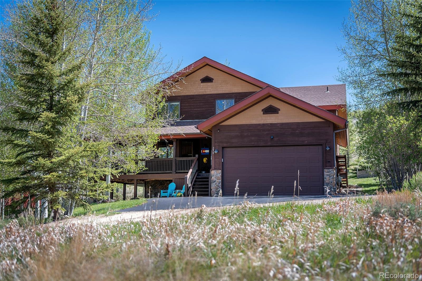 290 Village Road Granby, CO 80446 - Photo 4 of 45 a front view of a house with a yard