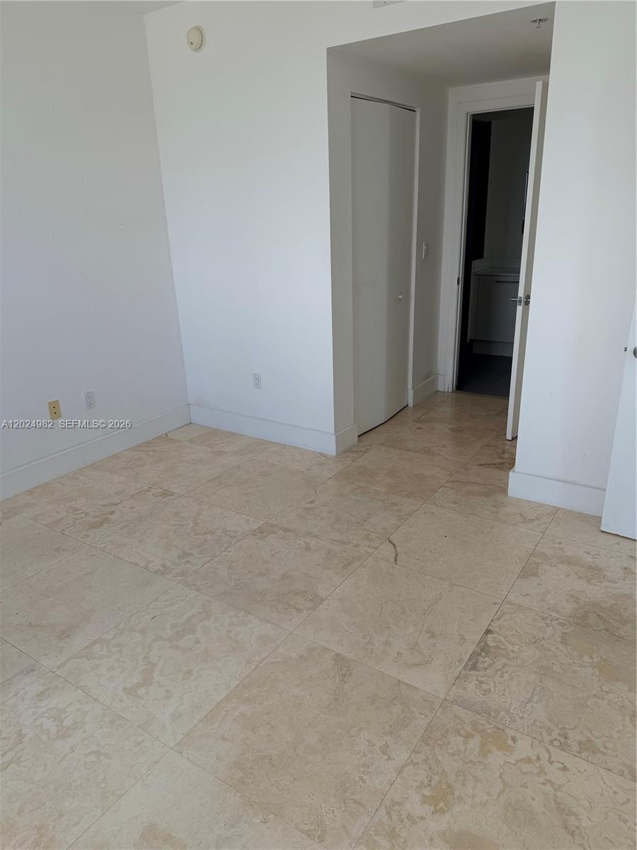 92 Southwest 3rd Street, Unit 3909 Miami, FL 33130 - Photo 7 of 13 a view of an empty room and closet