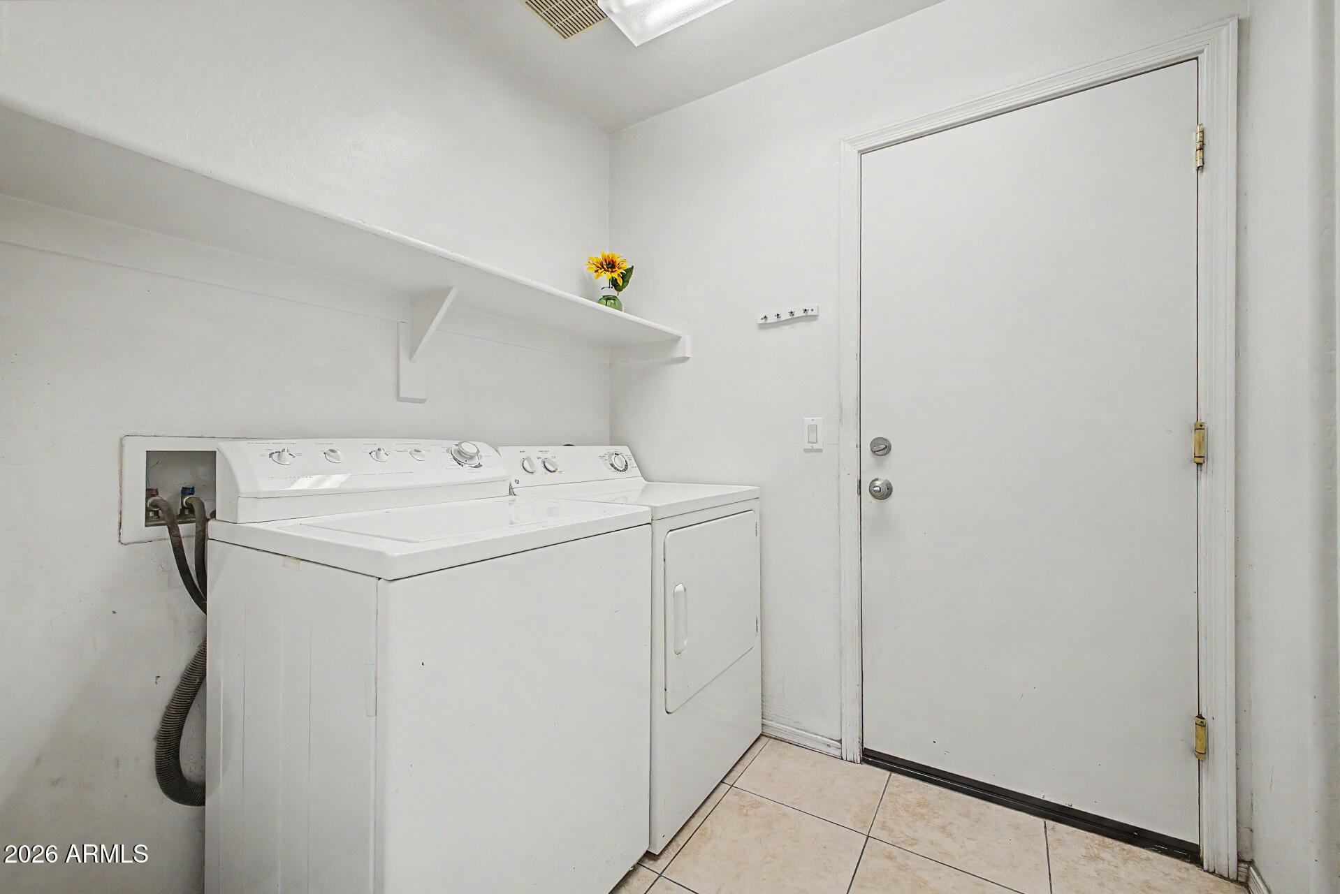 17236 West Durango Street Goodyear, AZ 85338 - Photo 13 of 14 a utility room with dryer and washer