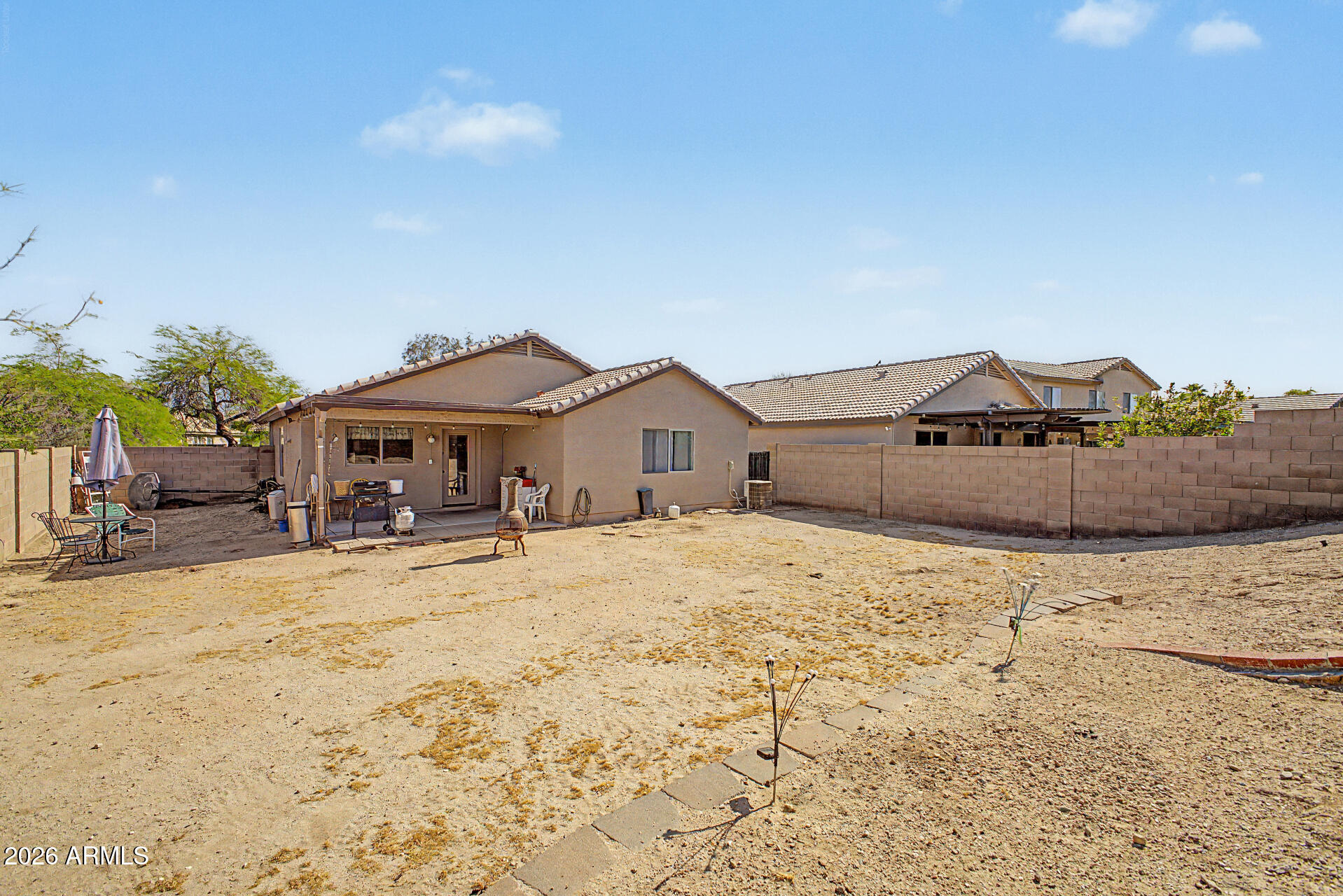 17236 West Durango Street Goodyear, AZ 85338 - Photo 14 of 14 a front view of a house with a yard covered with snow