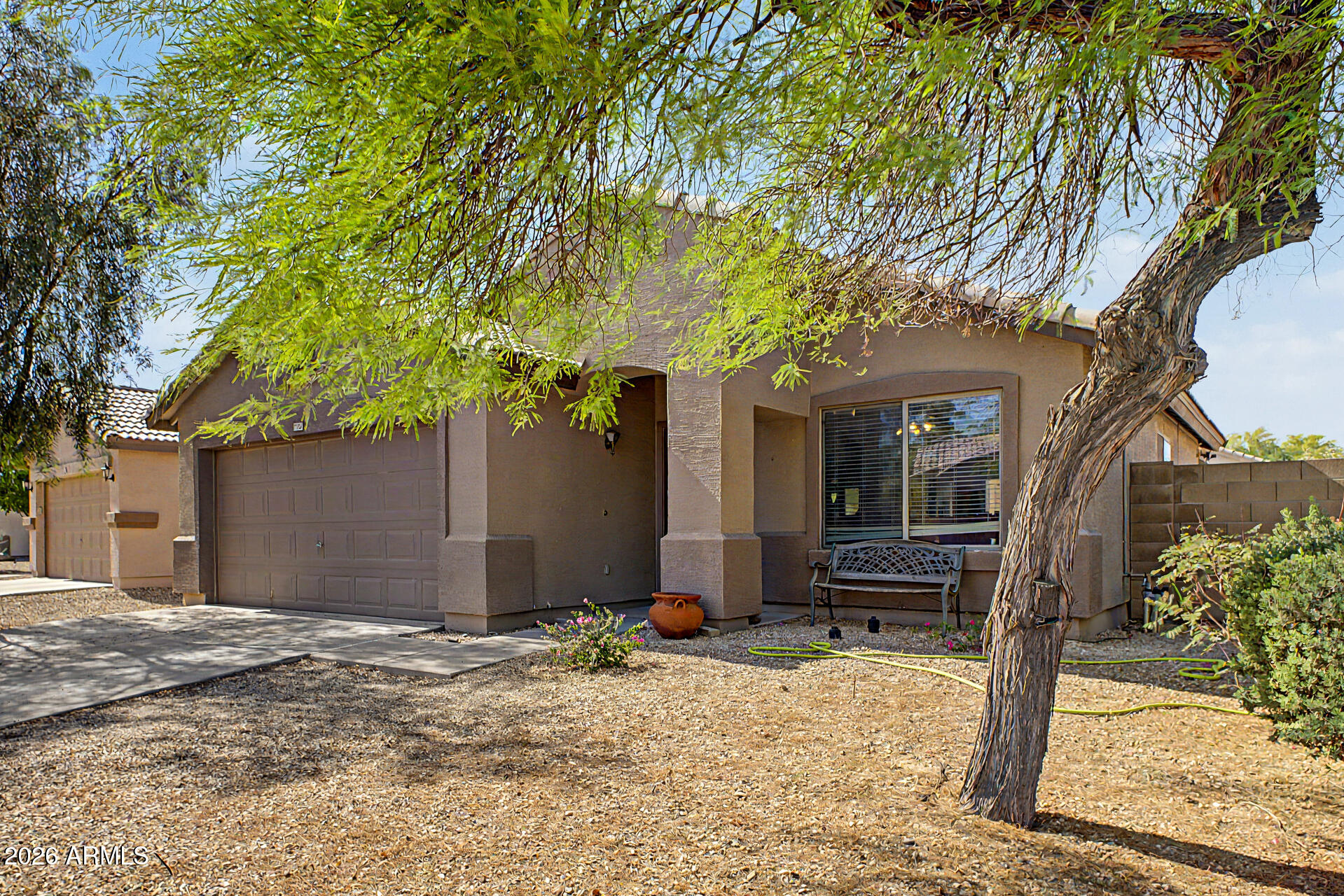 17236 West Durango Street Goodyear, AZ 85338 - Photo 3 of 14 a front view of a house with a yard and porch