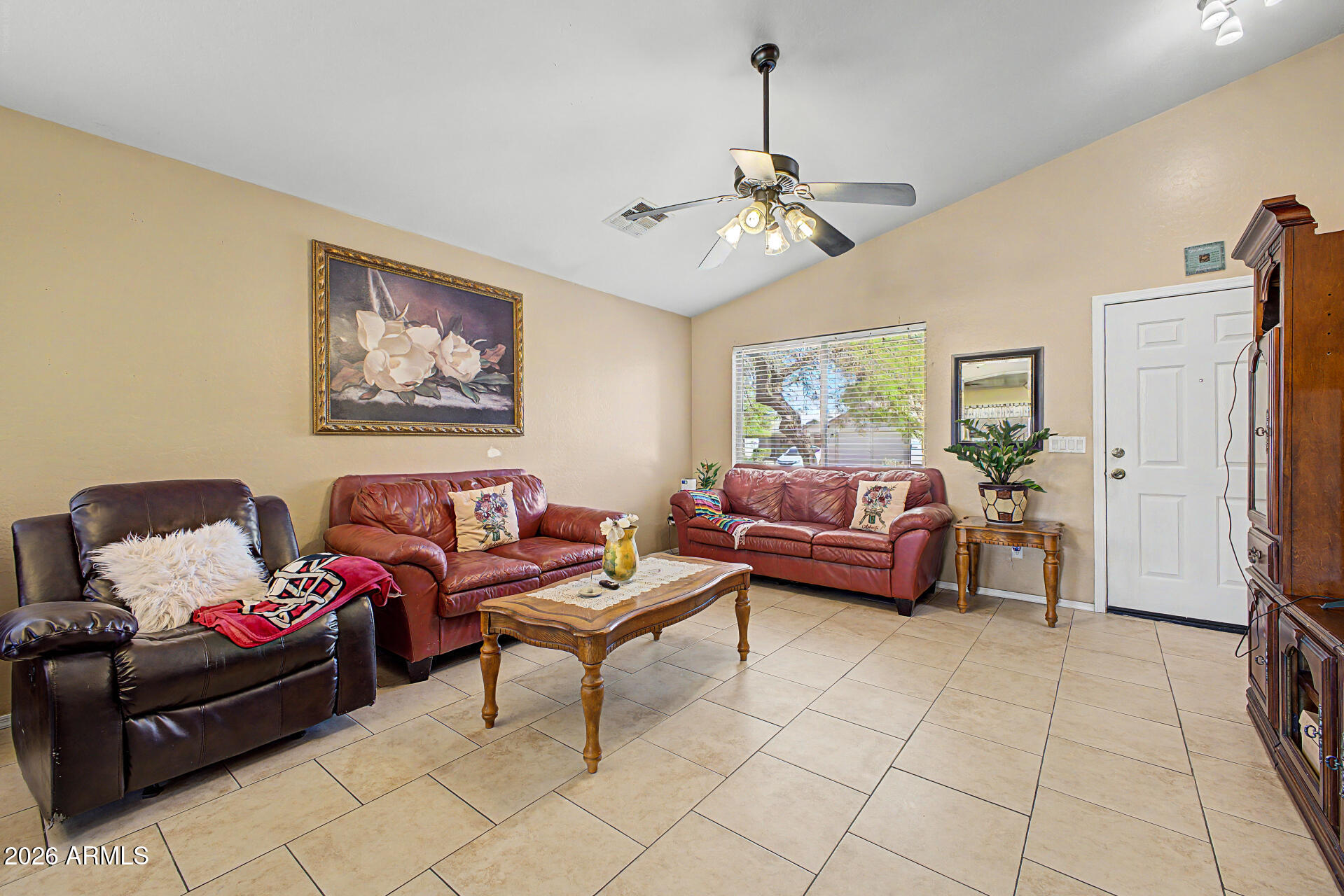 17236 West Durango Street Goodyear, AZ 85338 - Photo 5 of 14 a living room with furniture and a chandelier