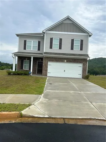 a house with yard in front of it