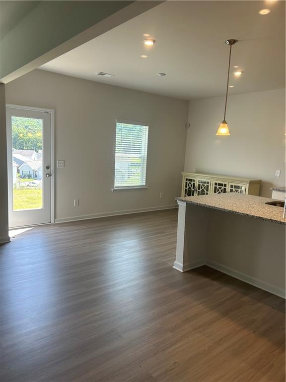 671 Mountaintop Road Cartersville, GA 30120 - Photo 8 of 14 an empty room with wooden floor and natural light