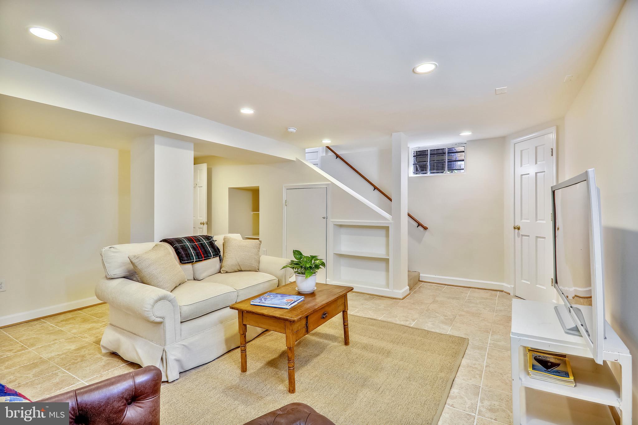 6111 Broad Branch Road Northwest Washington, DC 20015 - Photo 34 of 46 Rec Room w/side yard entrance on stair landing