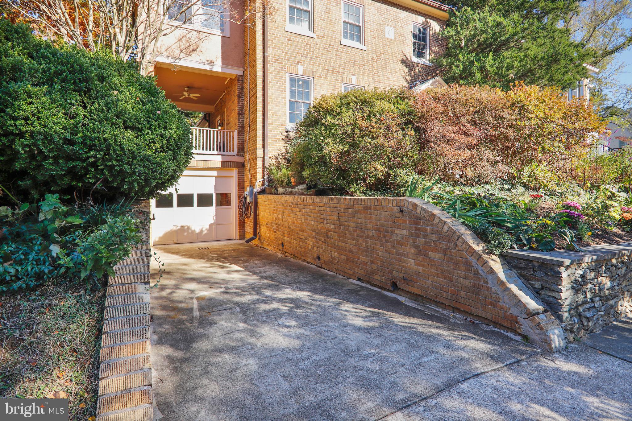 6111 Broad Branch Road Northwest Washington, DC 20015 - Photo 39 of 46 Exterior view of garage with driveway
