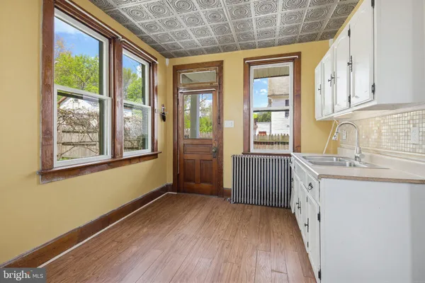 a bedroom with a bed and a chandelier fan