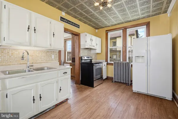 a view of a hallway with a livingroom