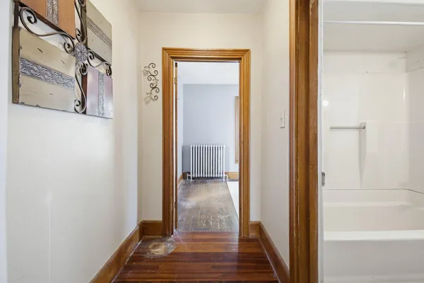 a view of wooden floor and windows in a room
