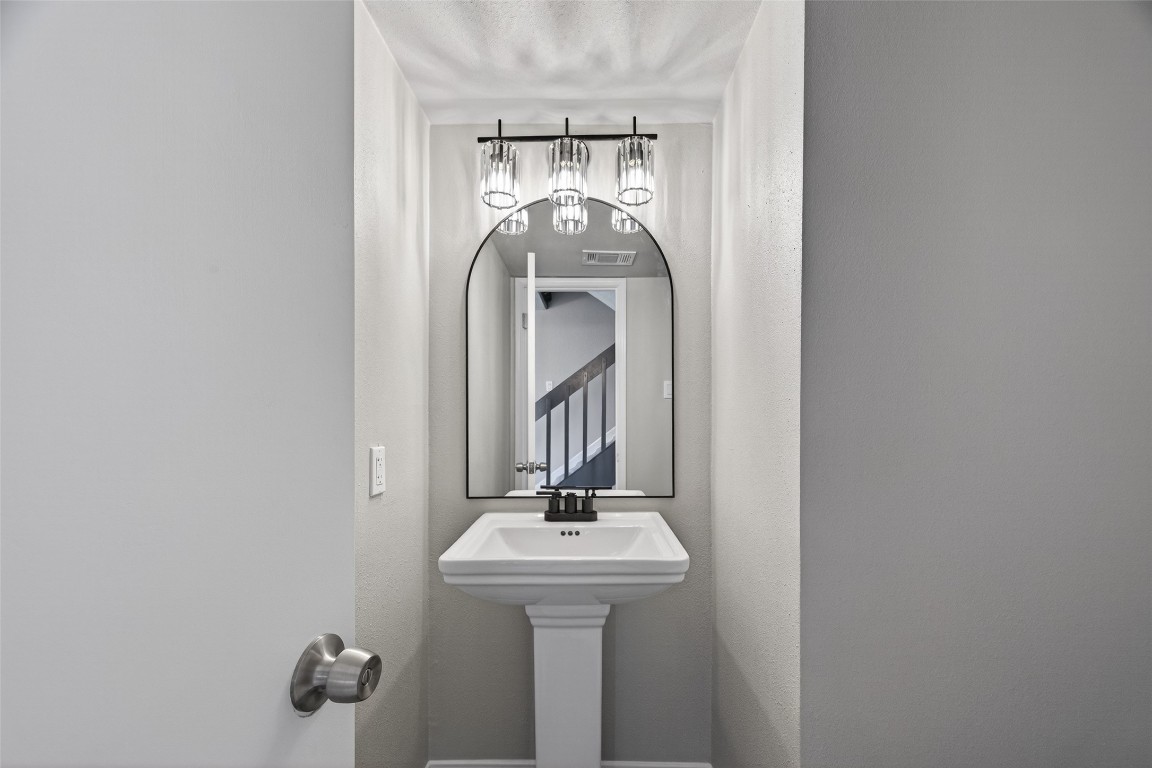 11406 Caesar Drive Houston, TX 77477 - Photo 19 of 32 a bathroom with a sink and mirror