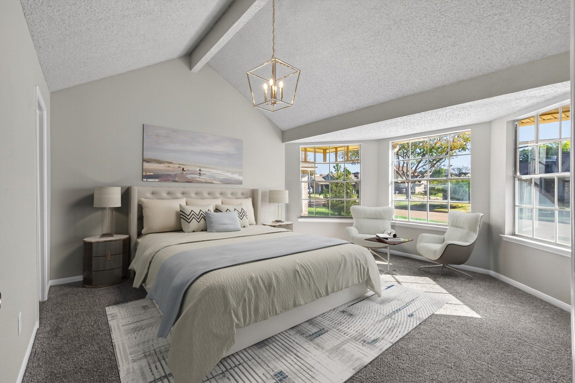 11406 Caesar Drive Houston, TX 77477 - Photo 6 of 32 a bedroom with a large bed and a chandelier