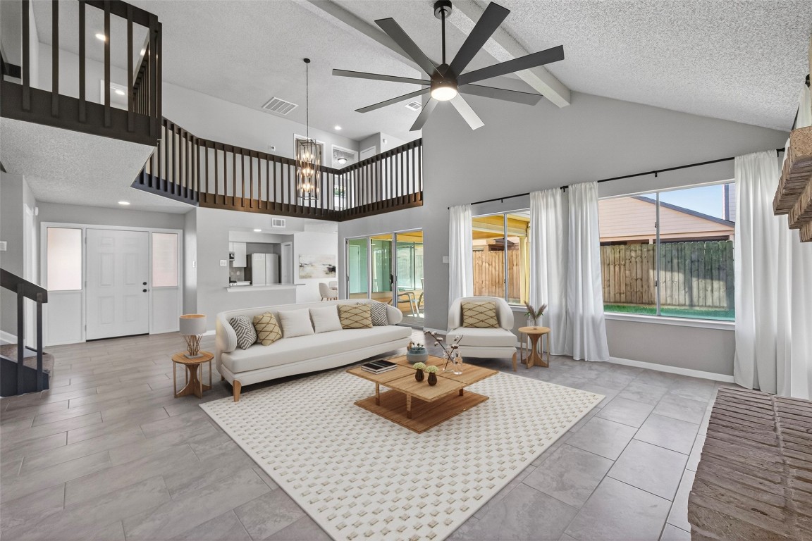 11406 Caesar Drive Houston, TX 77477 - Photo 9 of 32 a living room with furniture and a large window