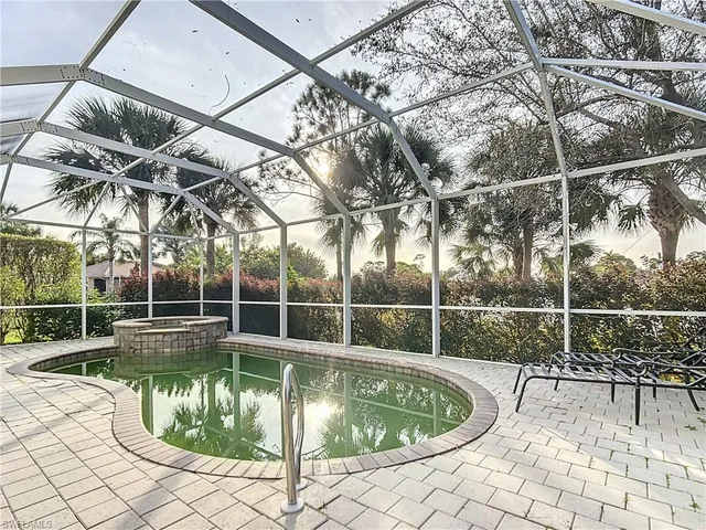 a view of a swimming pool with a patio