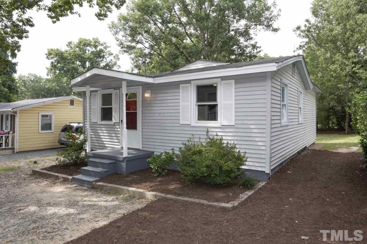 2308 Lilac Lane Raleigh, NC 27612 - Photo 2 of 25 a view of a house with a yard
