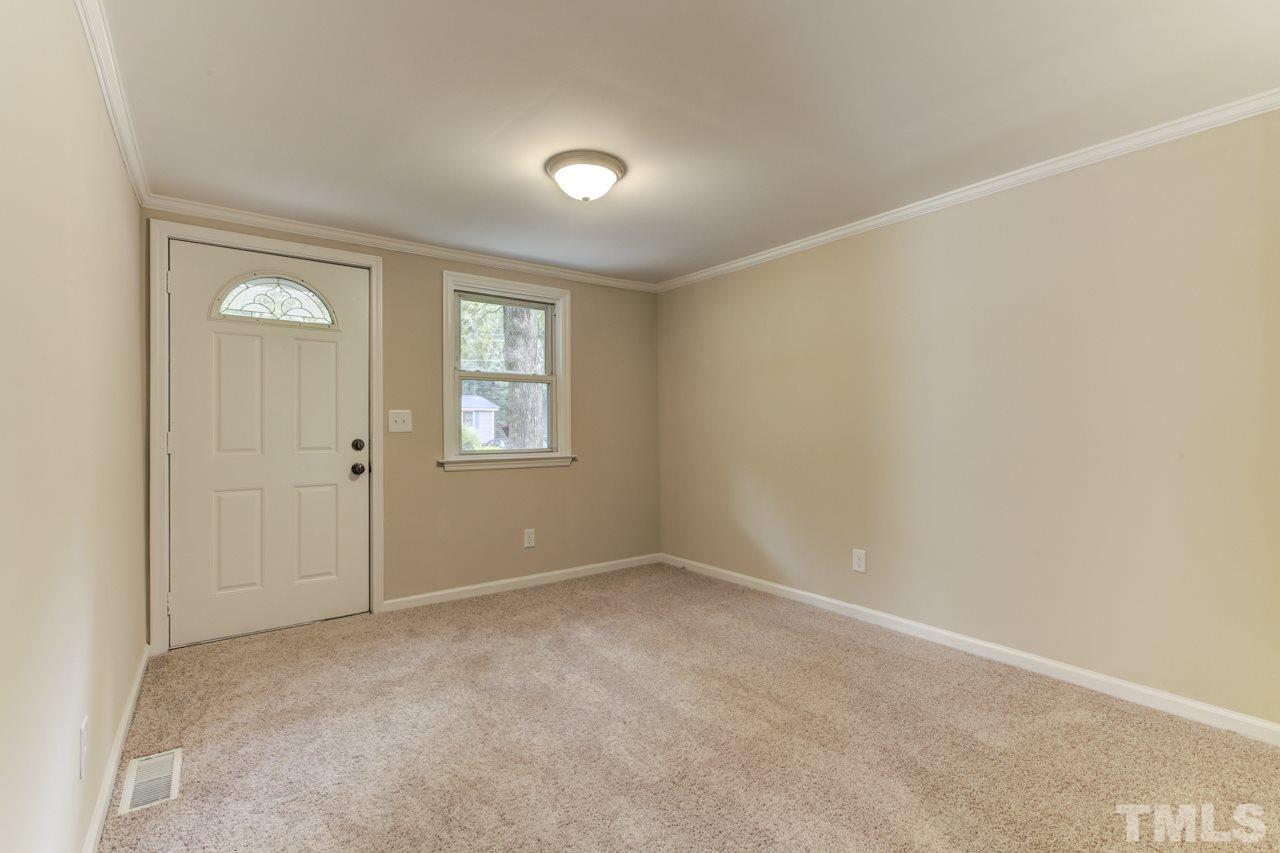 2308 Lilac Lane Raleigh, NC 27612 - Photo 11 of 25 an empty room with windows and closet