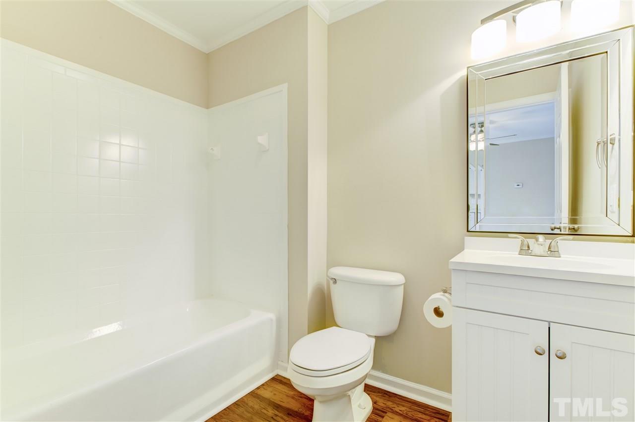 2308 Lilac Lane Raleigh, NC 27612 - Photo 15 of 25 a bathroom with a sink toilet and shower