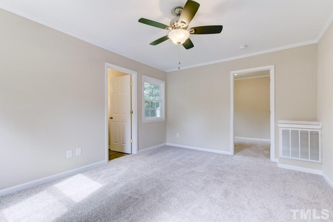 2308 Lilac Lane Raleigh, NC 27612 - Photo 16 of 25 a view of an empty room with a window