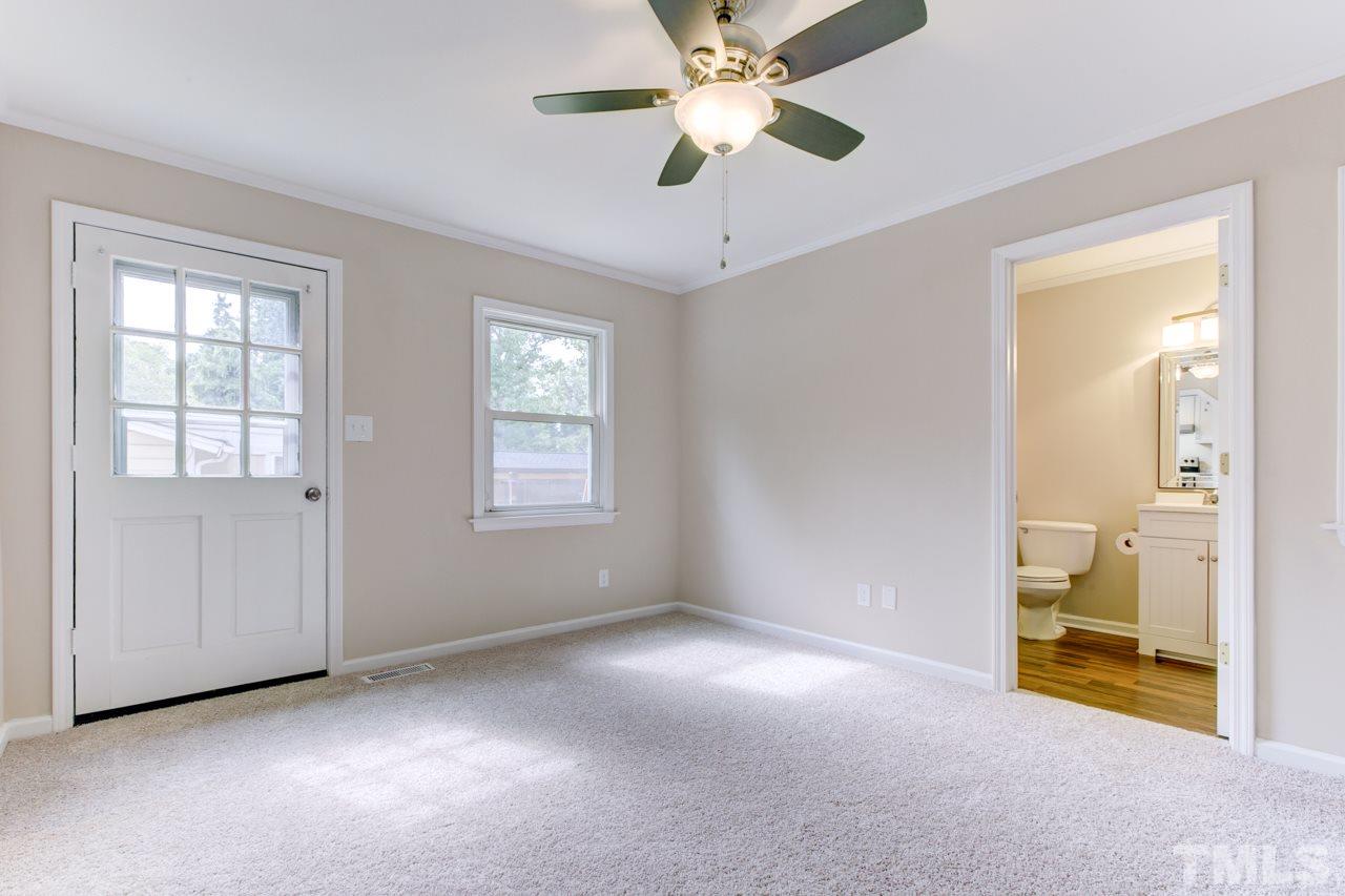 2308 Lilac Lane Raleigh, NC 27612 - Photo 20 of 25 an empty room with windows and fan