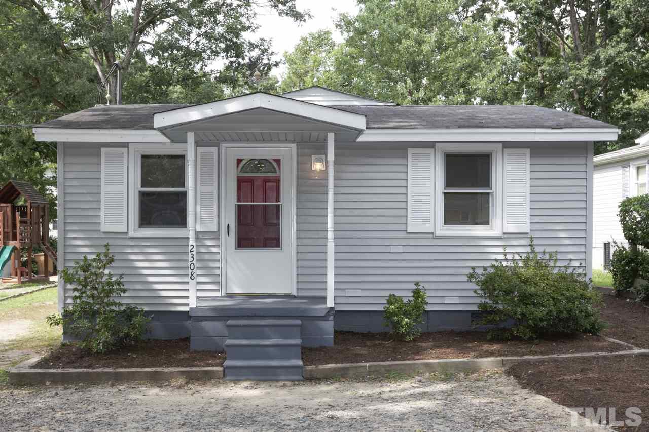 2308 Lilac Lane Raleigh, NC 27612 - Photo 4 of 25 a front view of a house with garden