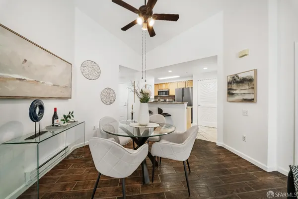 a view of a dining room with furniture and wooden floor