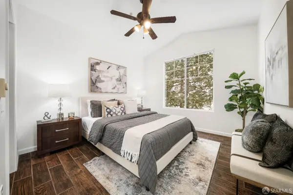 a bedroom with bed and furniture