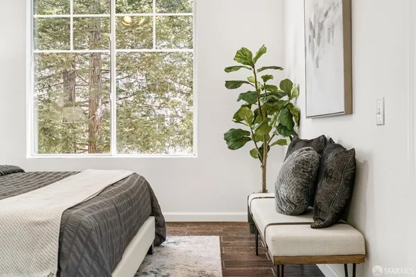 a bedroom with a bed and a lamp