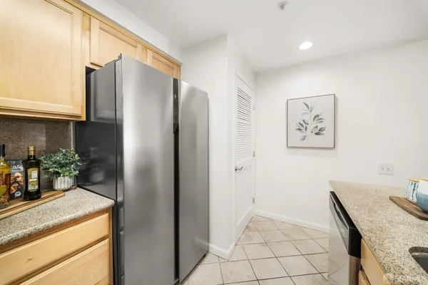 a view of kitchen with cabinets and wooden floor