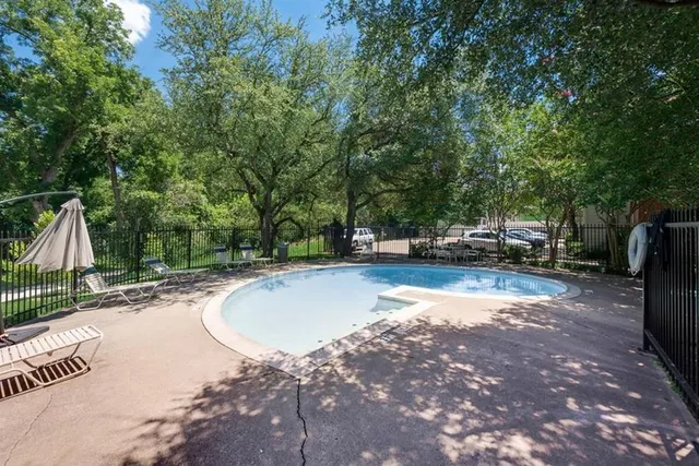 a view of a swimming pool with a patio