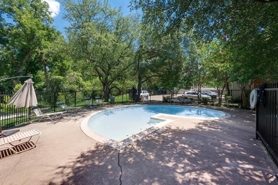6900 Skillman Street, Unit 101 Dallas, TX 75231 - Photo 11 of 13 a view of a swimming pool with a patio
