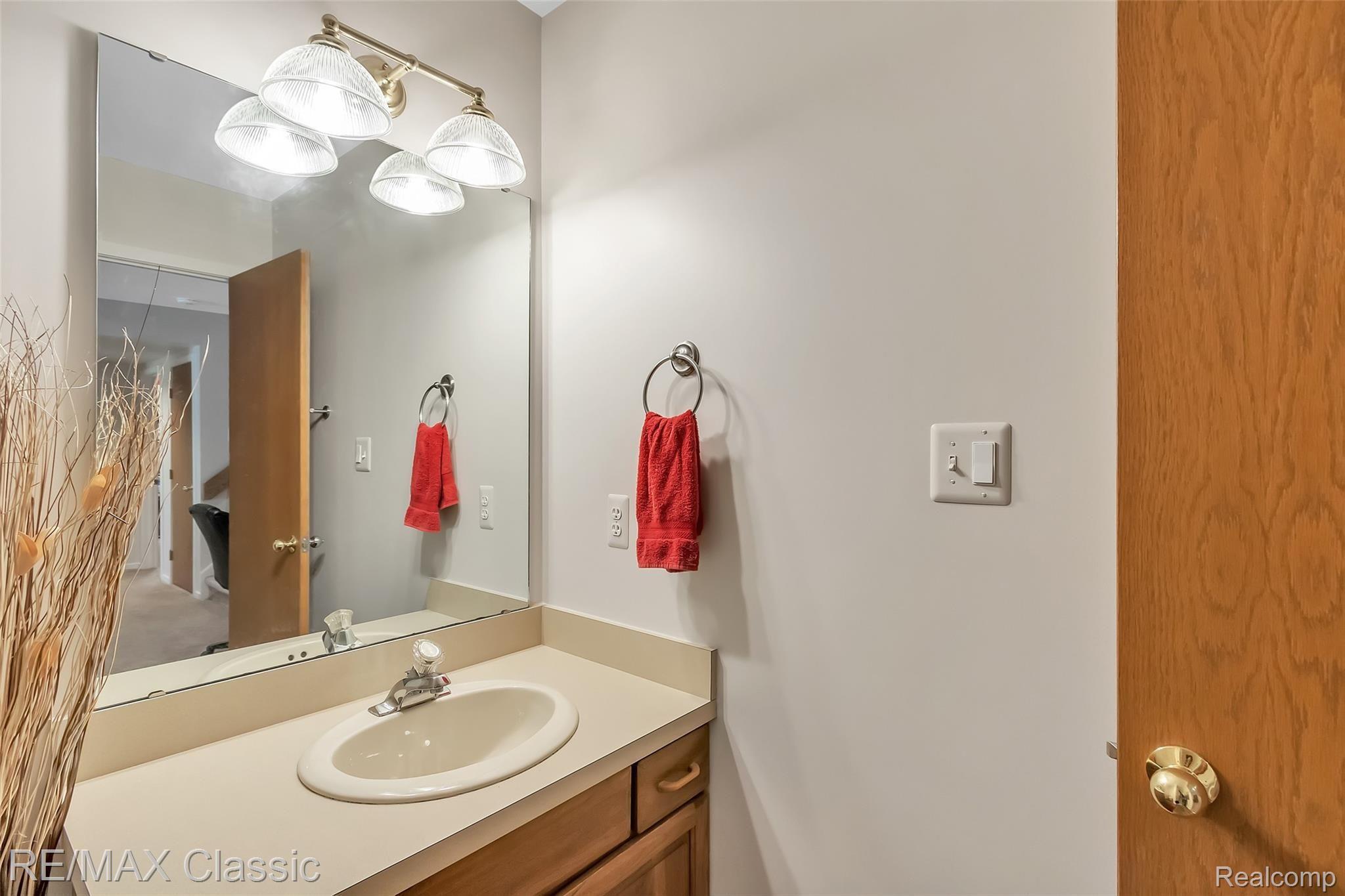 3344 Rivers Edge Drive Wayne, MI 48184 - Photo 37 of 50 Lower Level Full bathroom with Oak Vanity - yes there are 3 full bathroom in this condo. view 1 of 2