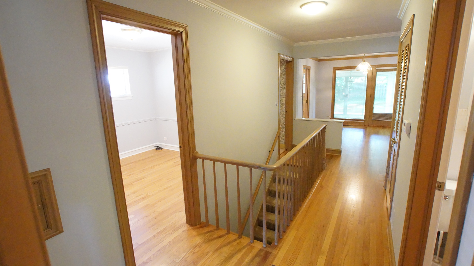 459 Highcrest Drive Wilmette, IL 60091 - Photo 12 of 26 a view of a hallway with wooden floor and staircase