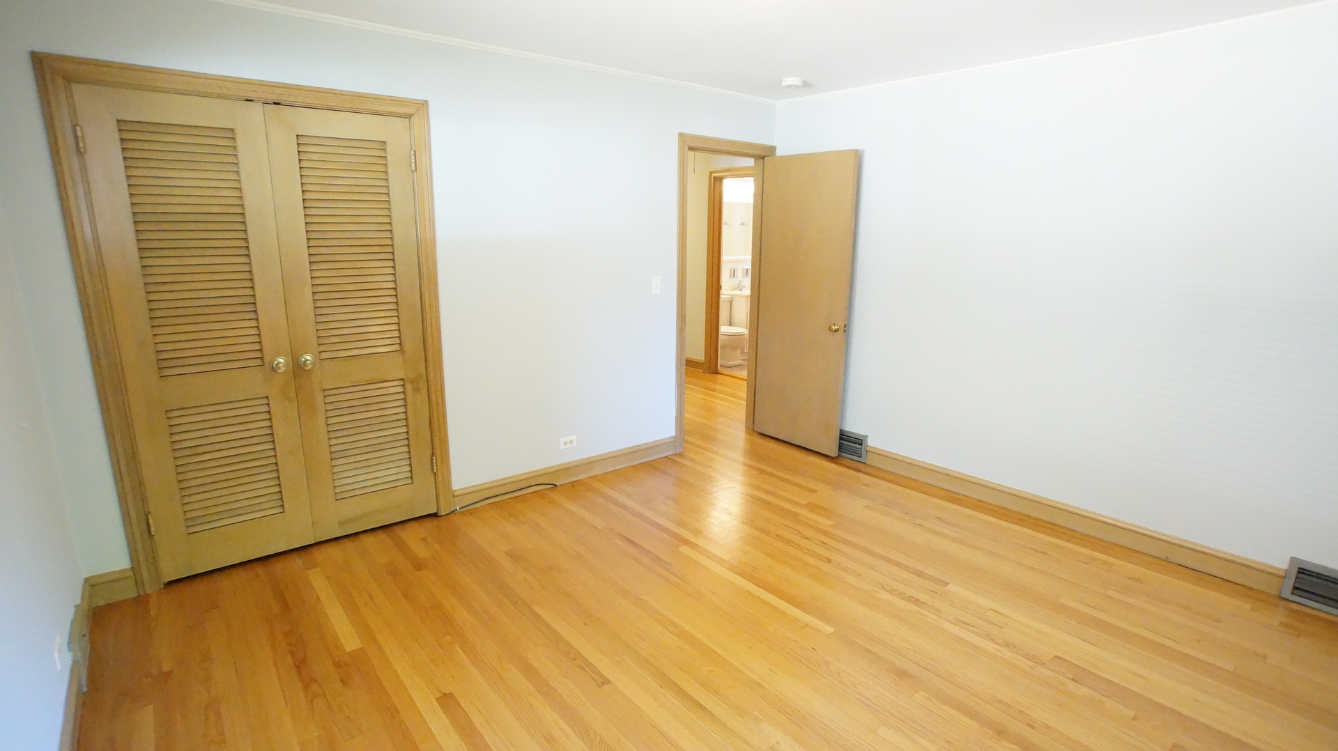 459 Highcrest Drive Wilmette, IL 60091 - Photo 16 of 26 a view of an empty room with wooden floor