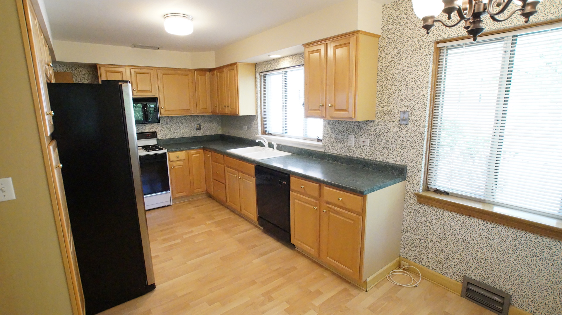 459 Highcrest Drive Wilmette, IL 60091 - Photo 8 of 26 a kitchen with stainless steel appliances granite countertop a refrigerator and a sink
