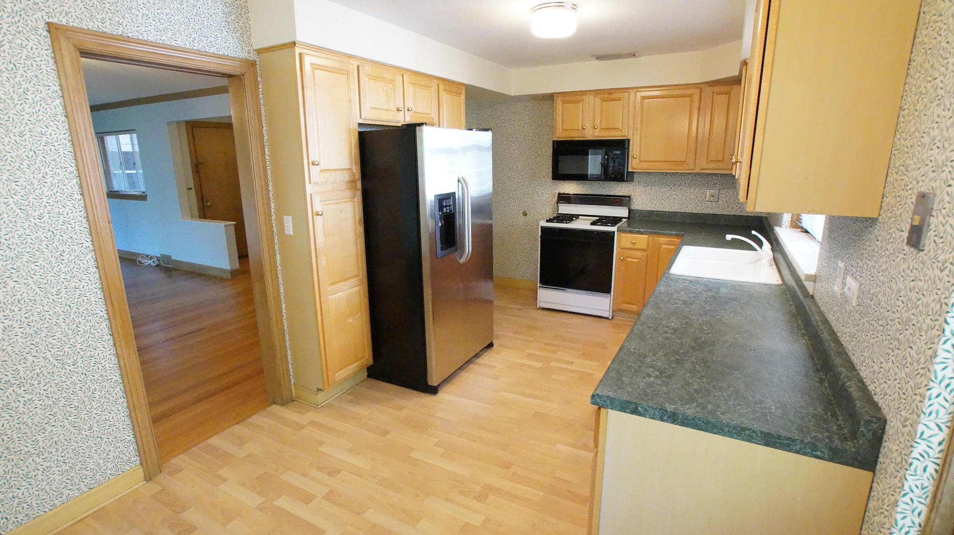 459 Highcrest Drive Wilmette, IL 60091 - Photo 9 of 26 a kitchen with granite countertop a refrigerator and a sink