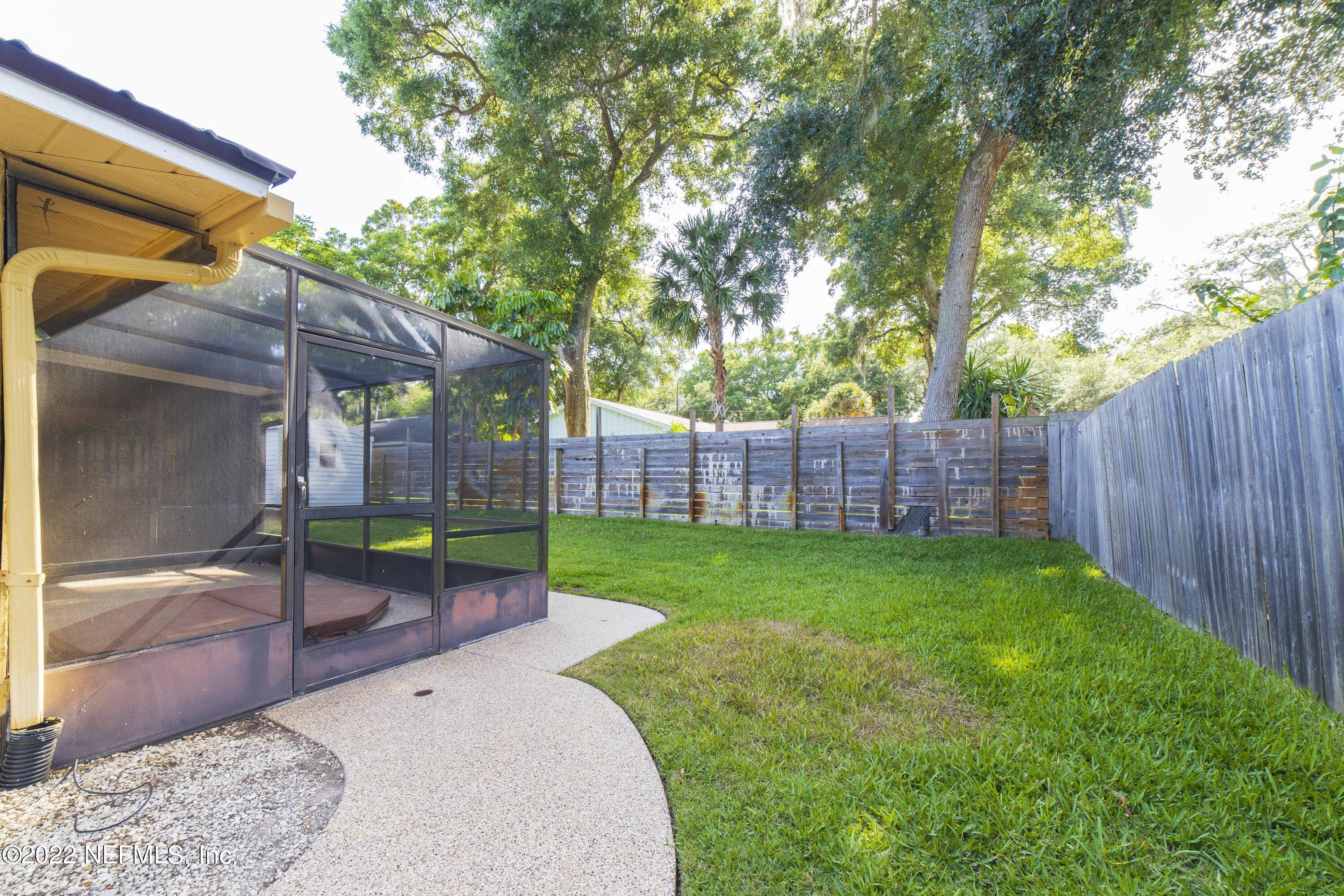 138 Drake Road St. Augustine, FL 32086 - Photo 35 of 46 a view of a backyard with a sink and wooden fence