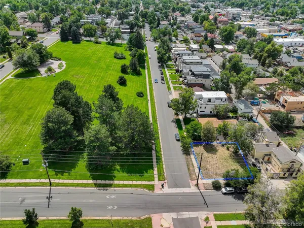 an aerial view of a houses with yard