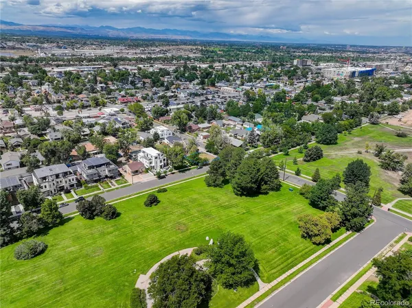 a view of a garden with a building in the background