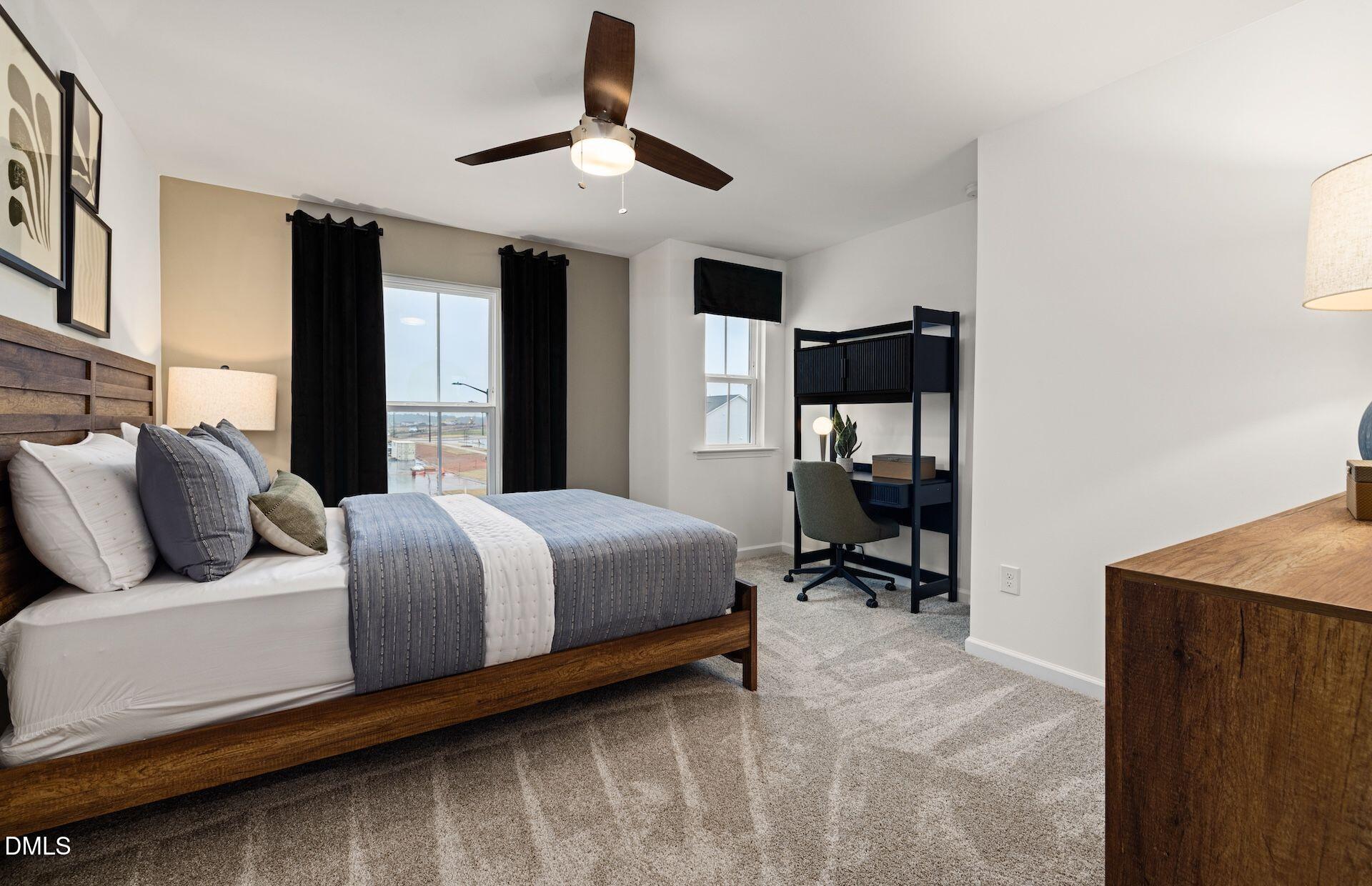 5020 Reader Way Durham, NC 27703 - Photo 18 of 32 a bedroom with a bed and a chandelier