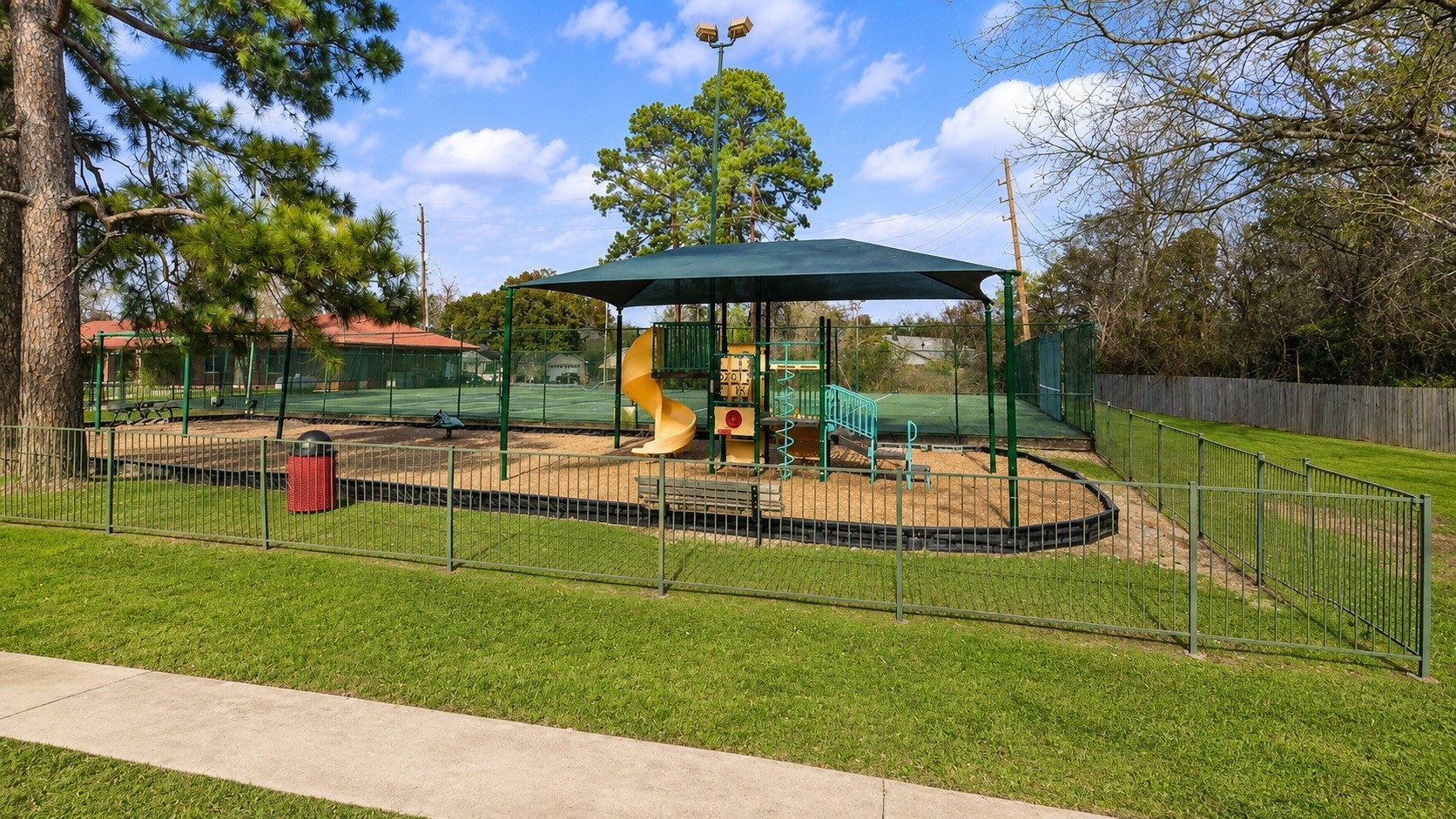 5810 Sunnygate Drive Spring, TX 77373 - Photo 15 of 16 a view of a park with swings