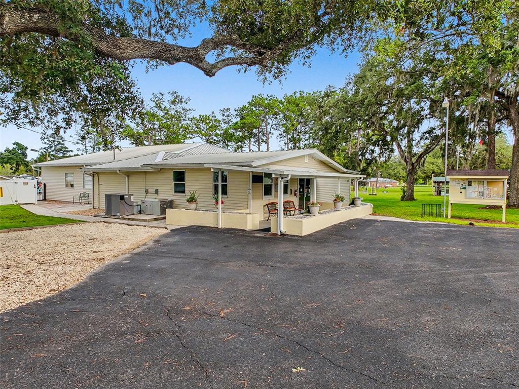 2092 Culbreath Road, Unit A42 Brooksville, FL 34602 - Photo 23 of 70 a view of a house with a yard and sitting area