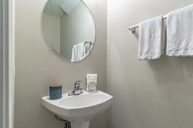 a bathroom with a sink and mirror