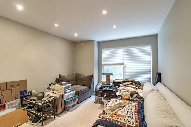 a bed room with furniture and a window