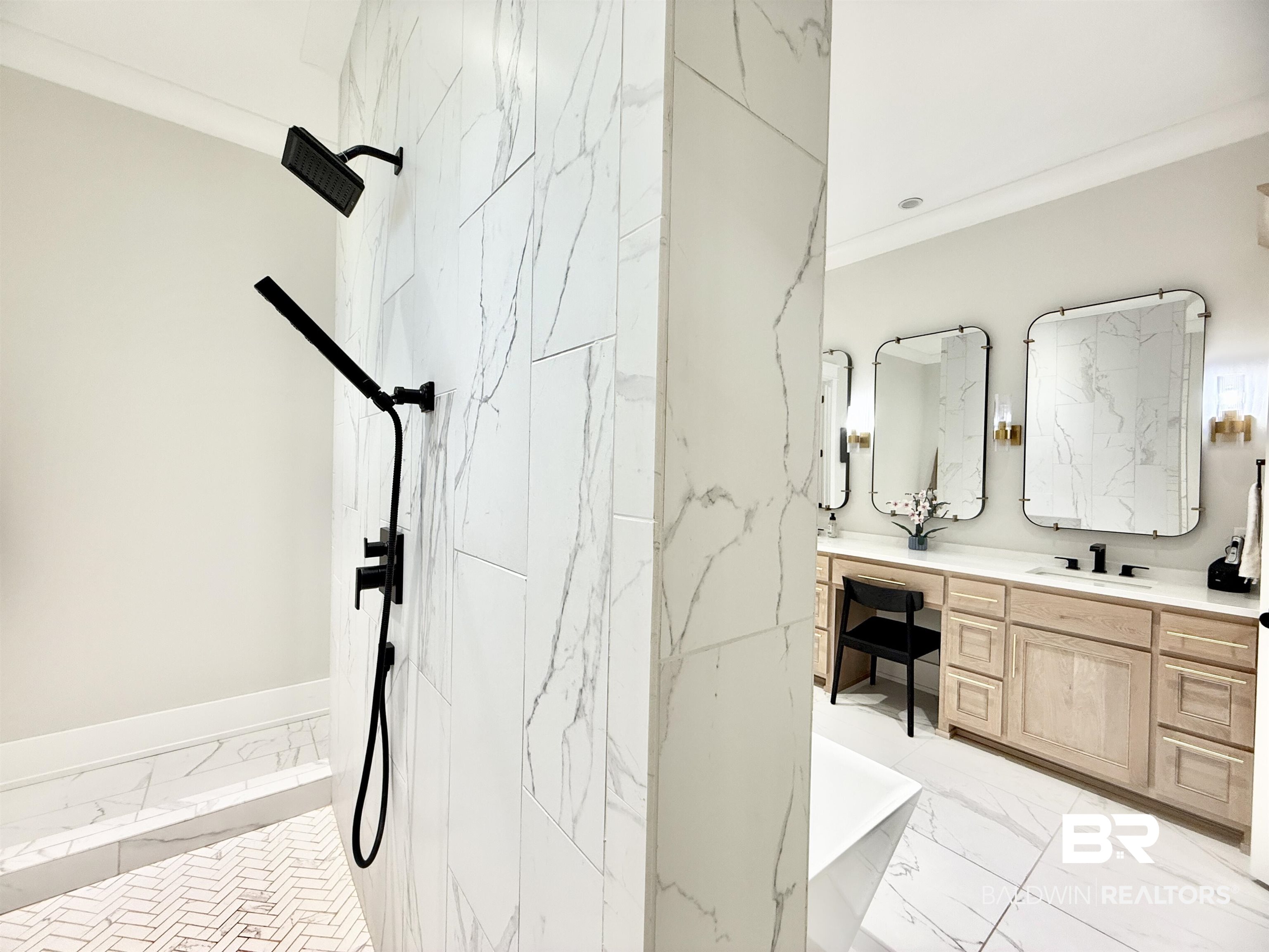 21767 Gallery Boulevard Fairhope, AL 36532 - Photo 36 of 74 Full bath with marble look tiles, double vanity, a marble finish shower, a soaking tub, and ornamental molding