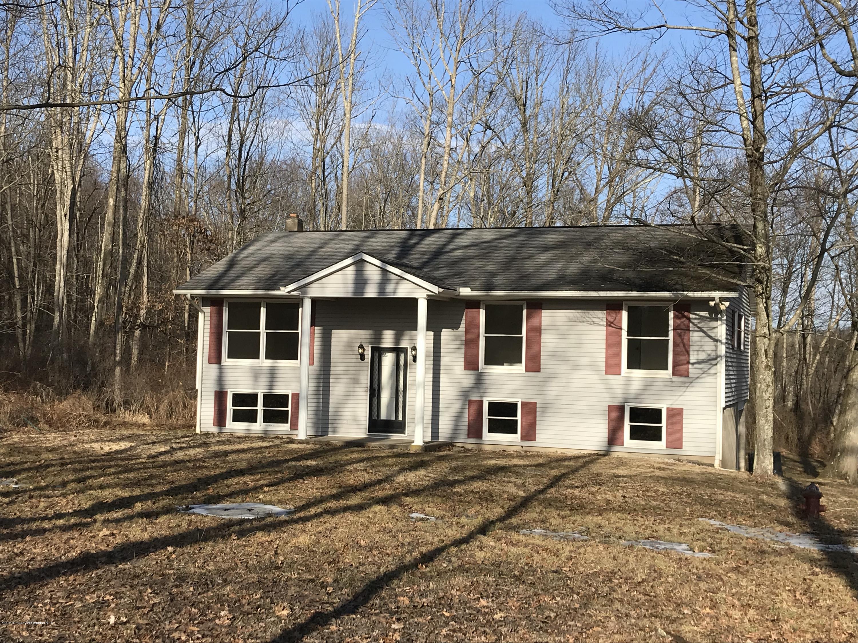 161 Ross Road Dalton, PA 18414 - Photo 1 of 25 a front view of a house with a yard