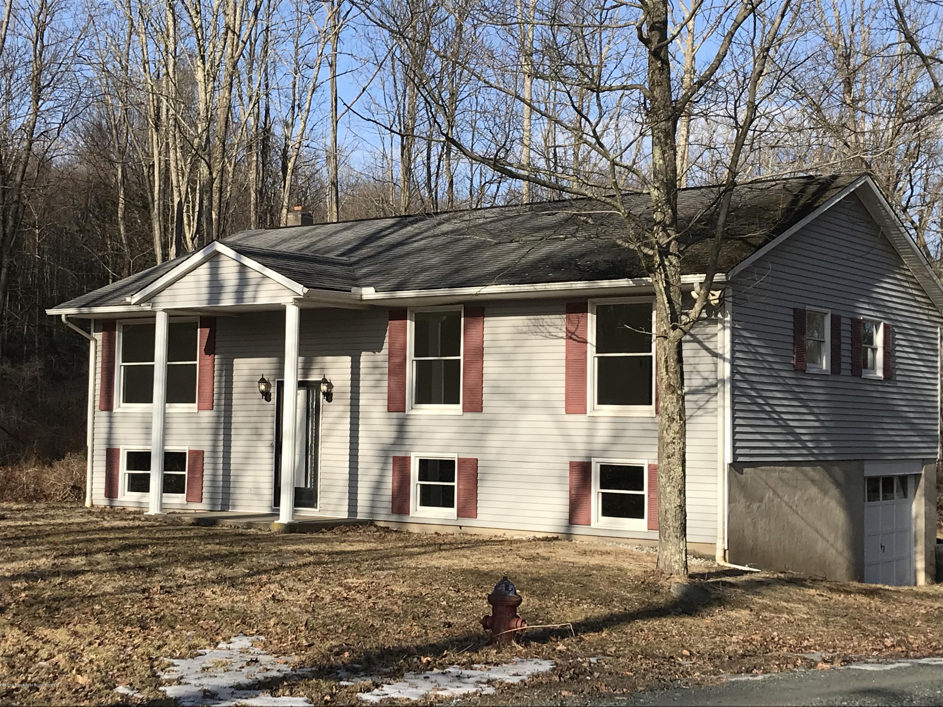 161 Ross Road Dalton, PA 18414 - Photo 2 of 25 a front view of a house with a yard